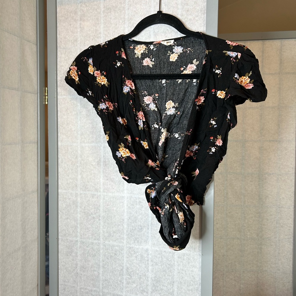 Garage black floral wrap top